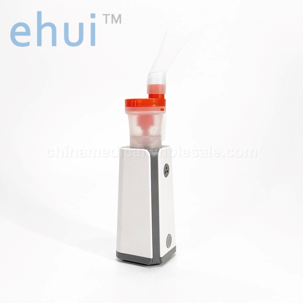 Portable inhaler with charger compressor atomizer